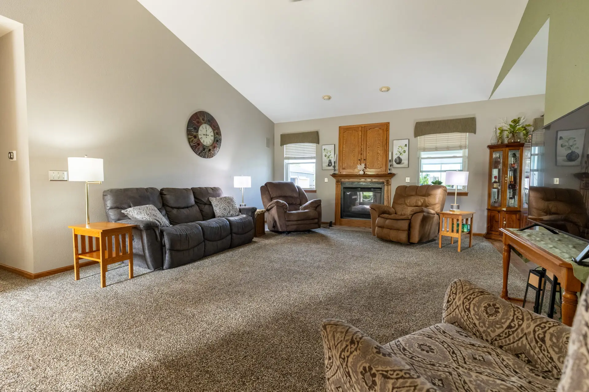 Carpet flooring in a Fond du Lac living room with a fireplace