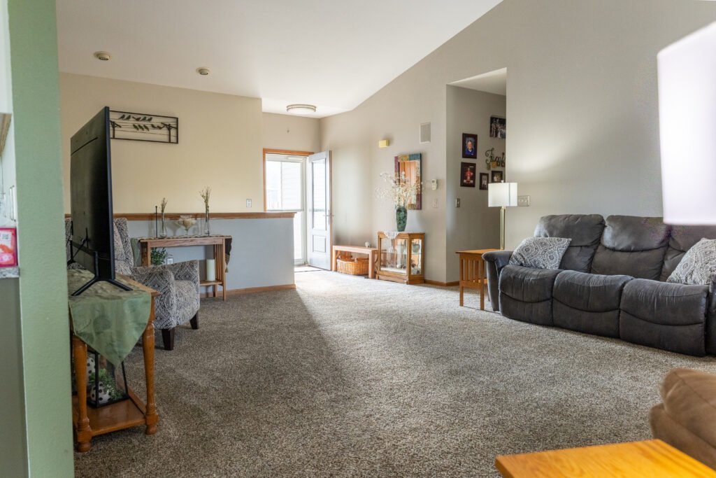 Living room in Fond du Lac with carpet flooring
